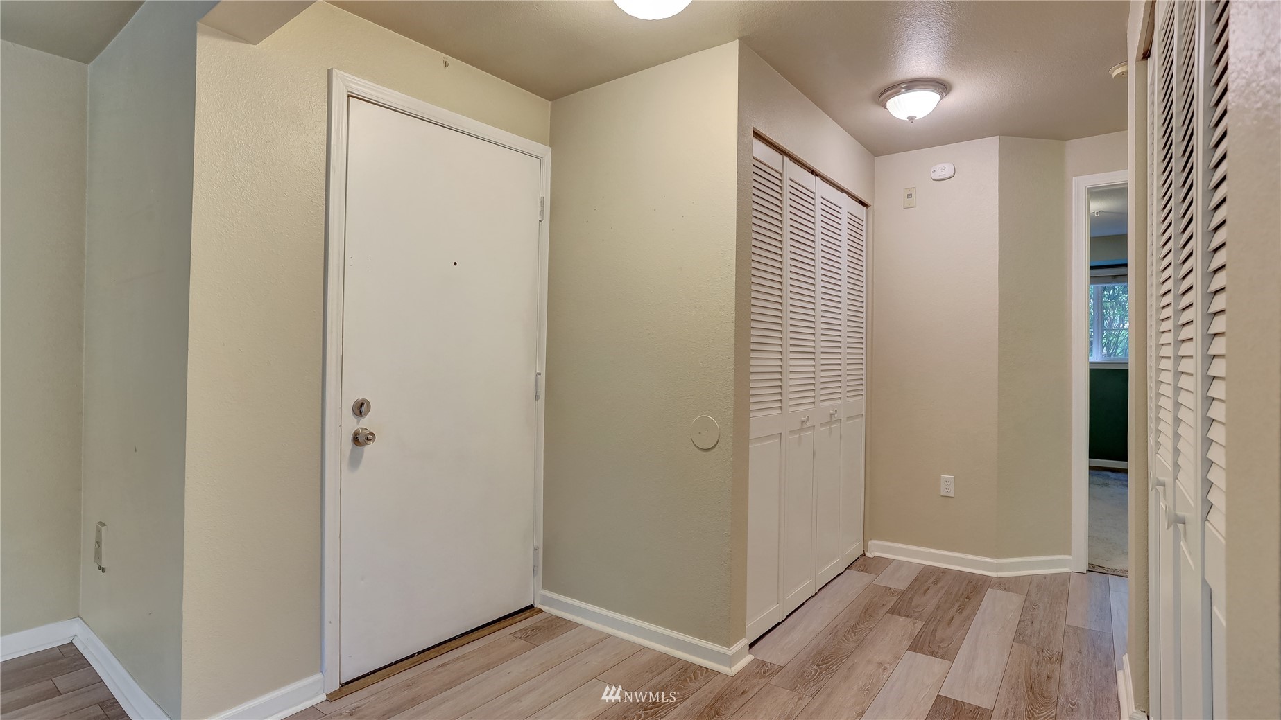 11002 Southeast Petrovitsky Road, Unit H101 Renton, WA 98055 - Photo 4 of 30 an empty room with wooden floor