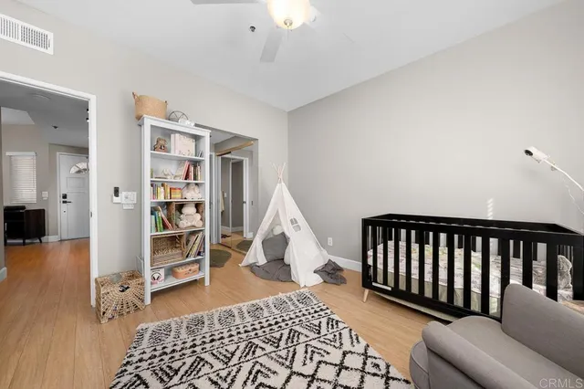 a living room with a couch and a book shelf