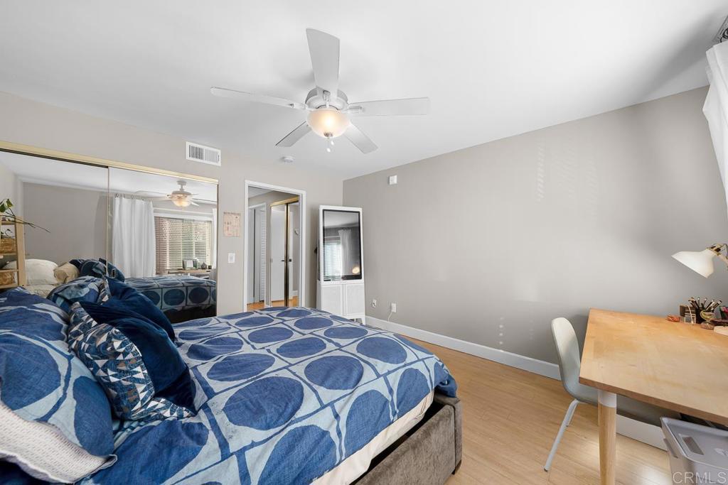 3666 Third Avenue, Unit 202 San Diego, CA 92103 - Photo 17 of 31 a bedroom with a bed and a chair