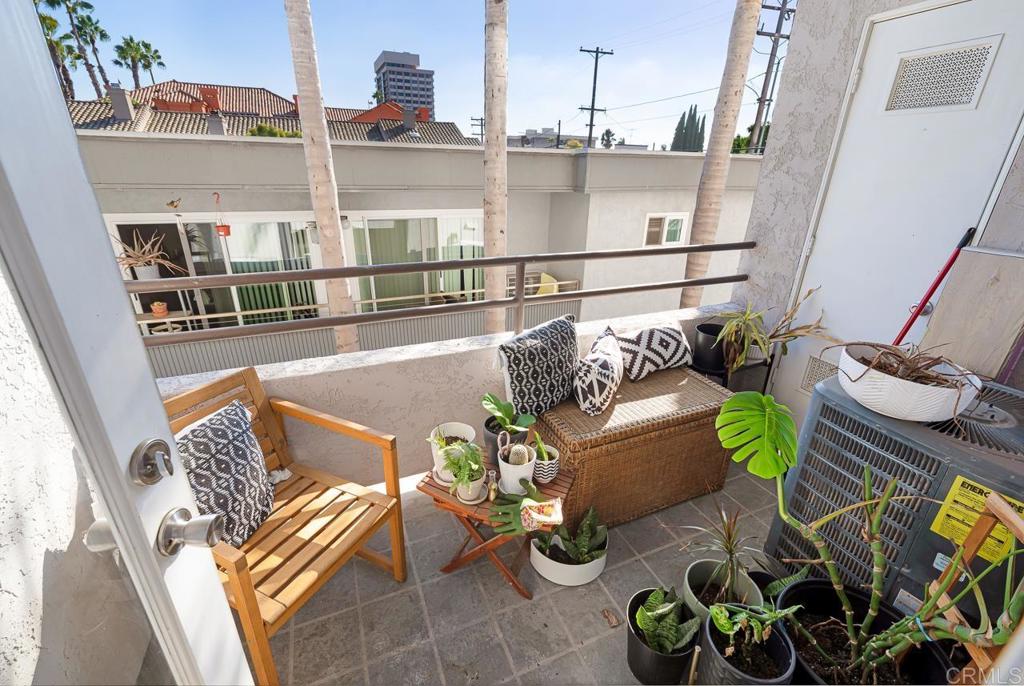 3666 Third Avenue, Unit 202 San Diego, CA 92103 - Photo 21 of 31 a view of a chairs and table in a balcony