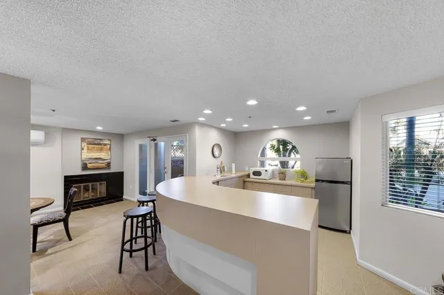a large kitchen with a table and chairs