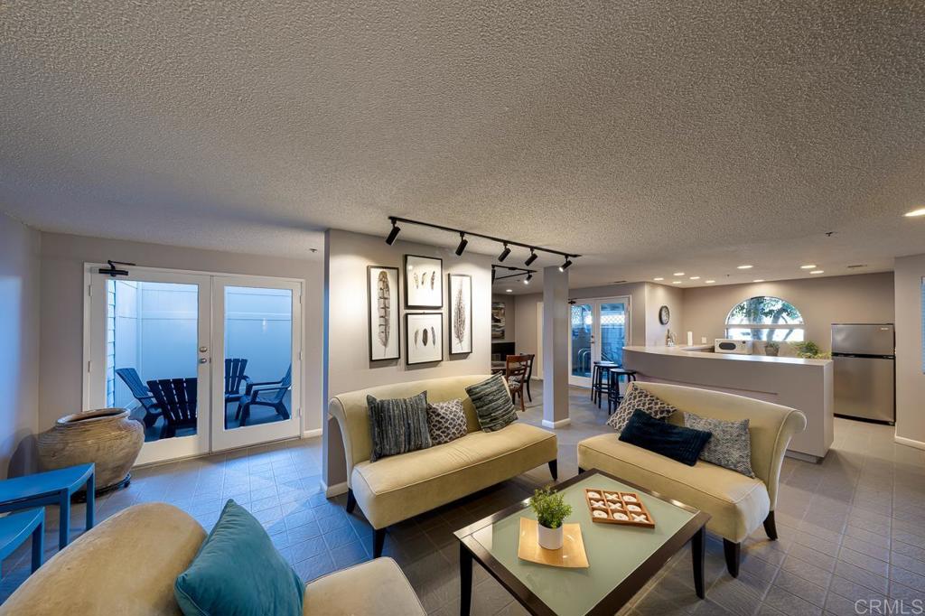 3666 Third Avenue, Unit 202 San Diego, CA 92103 - Photo 25 of 31 a living room with furniture and wooden floor