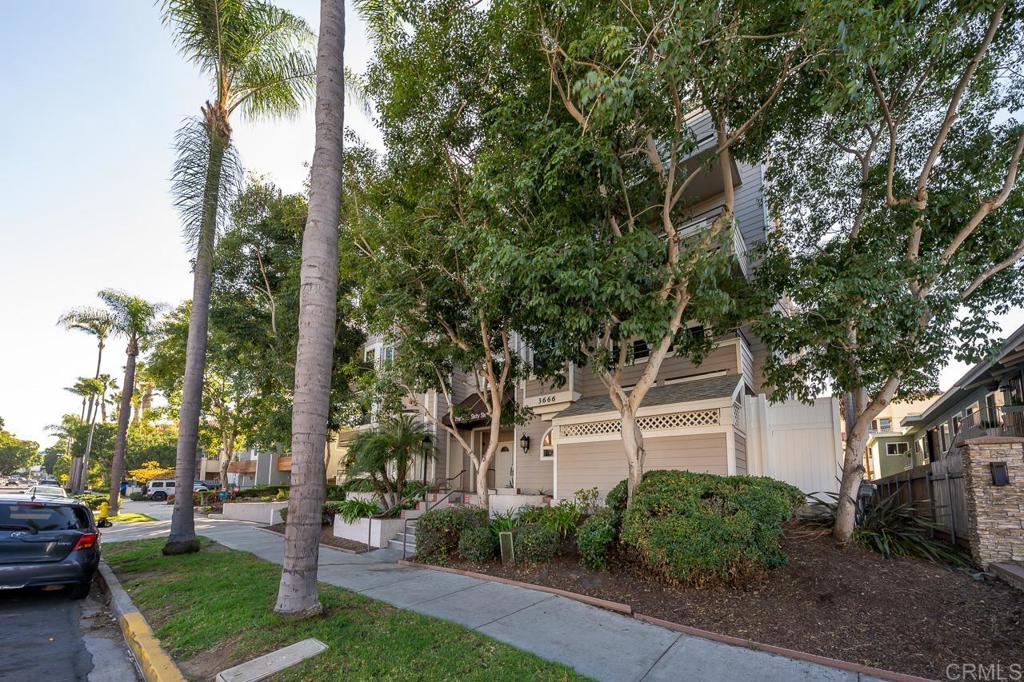 3666 Third Avenue, Unit 202 San Diego, CA 92103 - Photo 30 of 31 a front view of a house with garden and trees