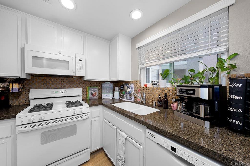 3666 Third Avenue, Unit 202 San Diego, CA 92103 - Photo 6 of 31 a kitchen with appliances a sink and cabinets