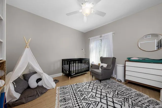 a bedroom with furniture and a window
