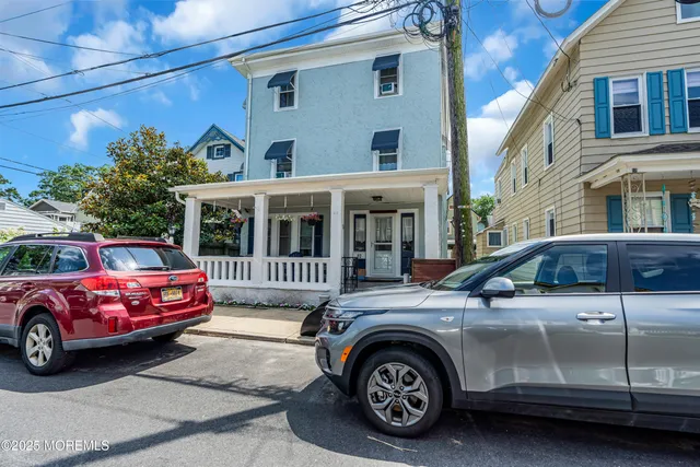 a view of a porch with furniture and garden