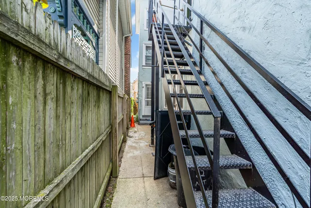 an aerial view of multiple houses with a yard