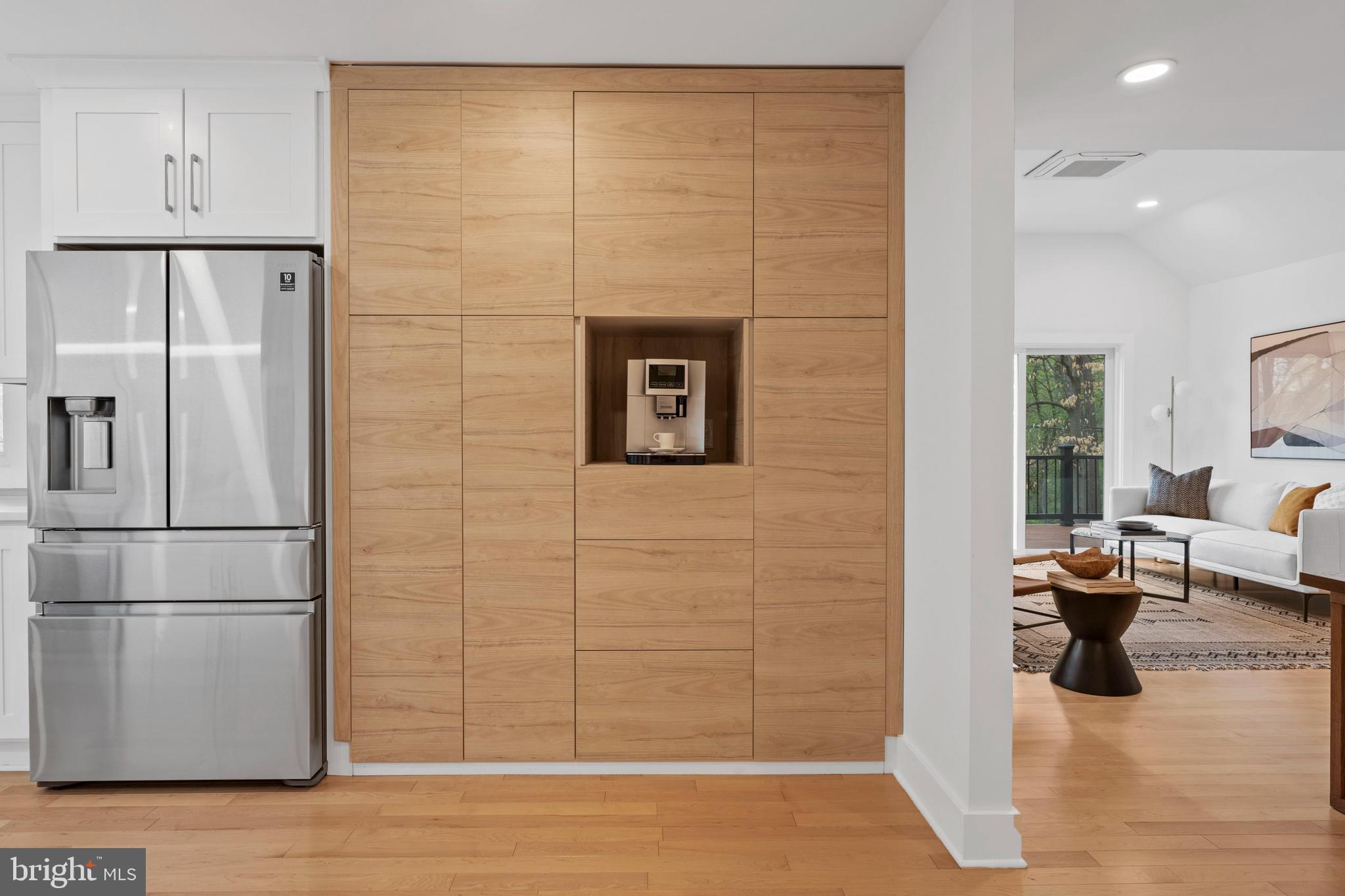 6522 Walhonding Road Bethesda, MD 20816 - Photo 12 of 76 a kitchen with stainless steel appliances granite countertop a refrigerator and a wooden floor