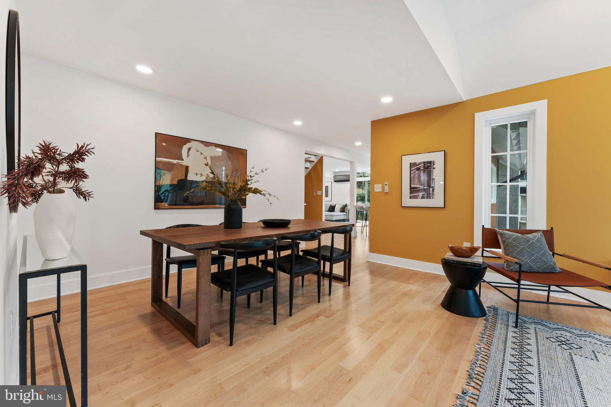 6522 Walhonding Road Bethesda, MD 20816 - Photo 15 of 76 a view of a dining room with furniture window and wooden floor