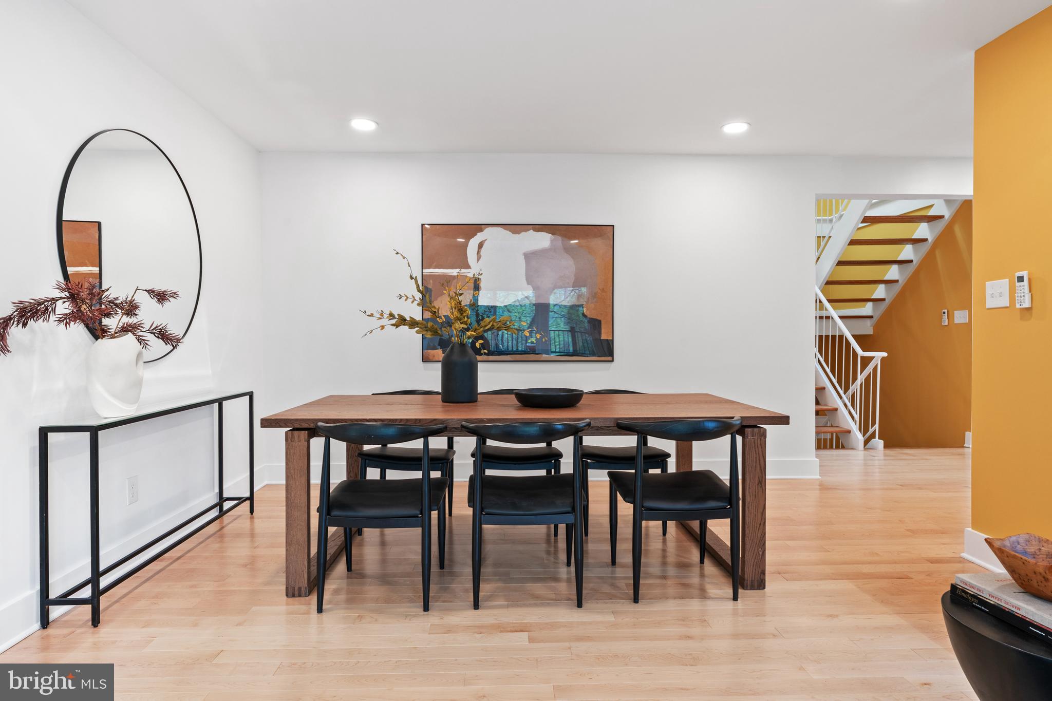 6522 Walhonding Road Bethesda, MD 20816 - Photo 16 of 76 a view of a dining room with furniture and wooden floor