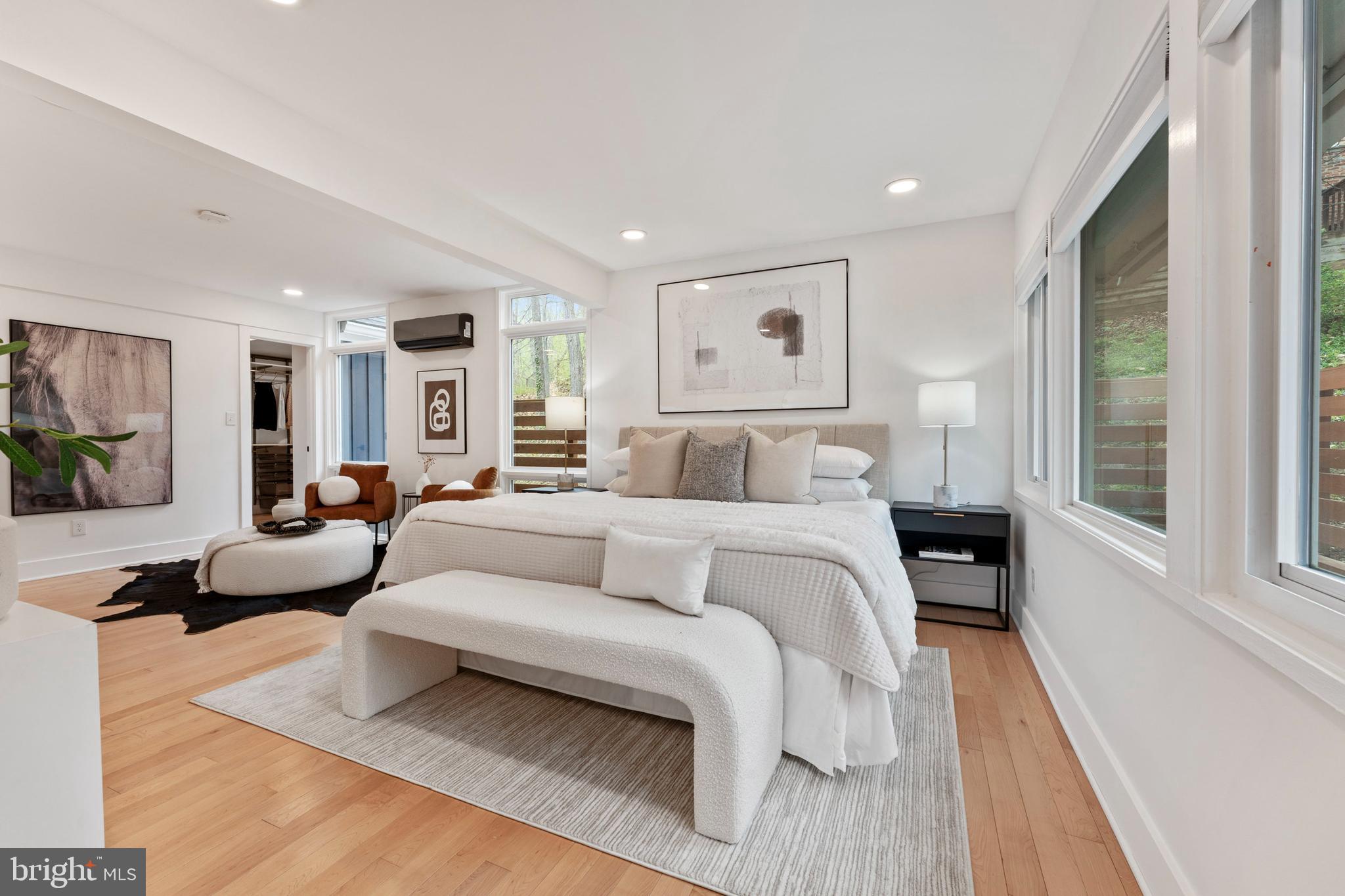 6522 Walhonding Road Bethesda, MD 20816 - Photo 22 of 76 a bedroom with a large bed and a couch