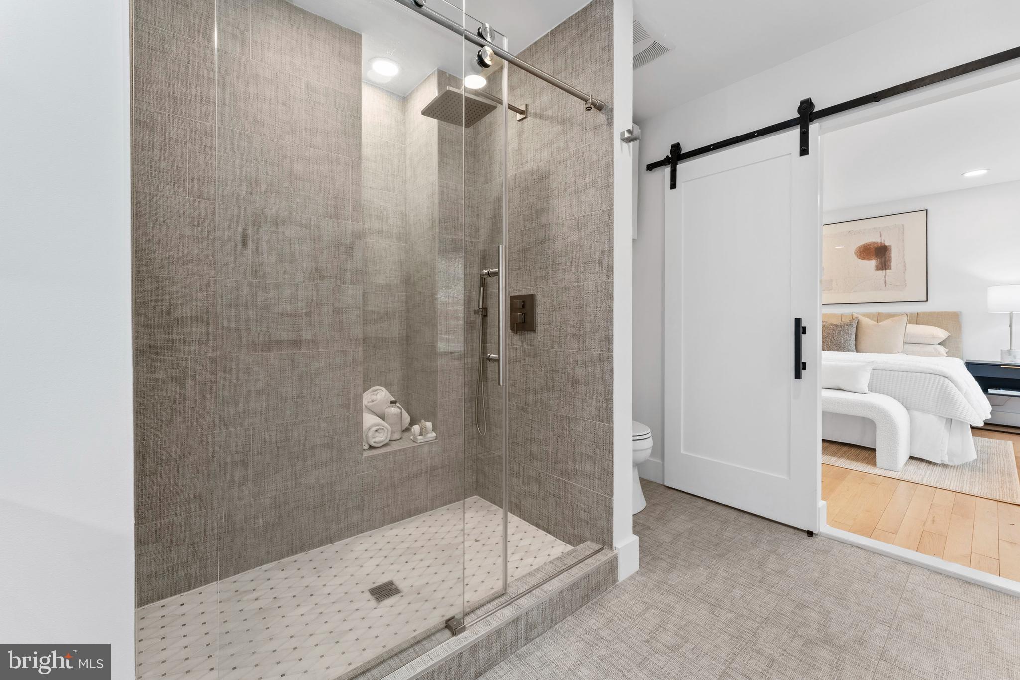 6522 Walhonding Road Bethesda, MD 20816 - Photo 27 of 76 a bathroom with a shower and a bathtub