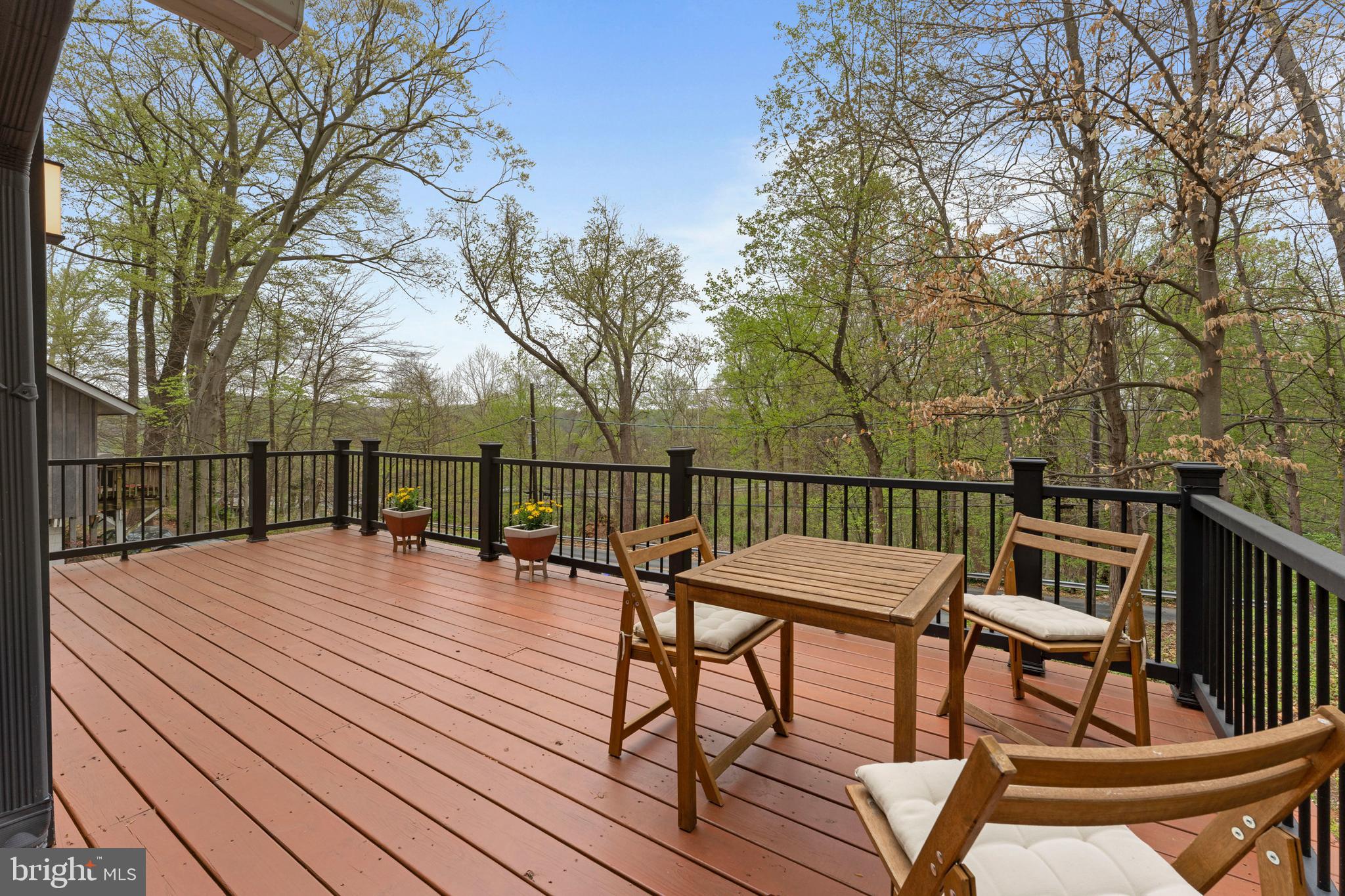 6522 Walhonding Road Bethesda, MD 20816 - Photo 33 of 76 a view of balcony with wooden floor and outdoor seating