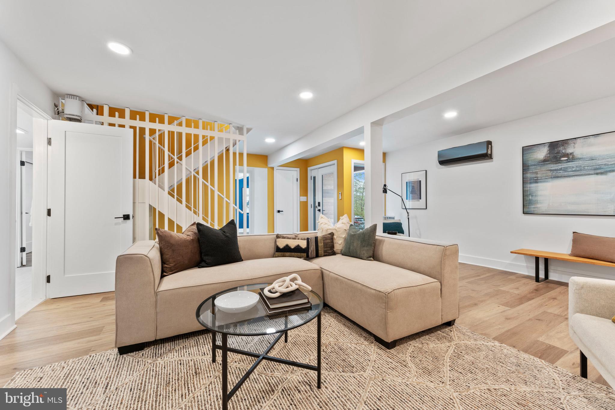 6522 Walhonding Road Bethesda, MD 20816 - Photo 50 of 76 a living room with furniture and a wooden floor