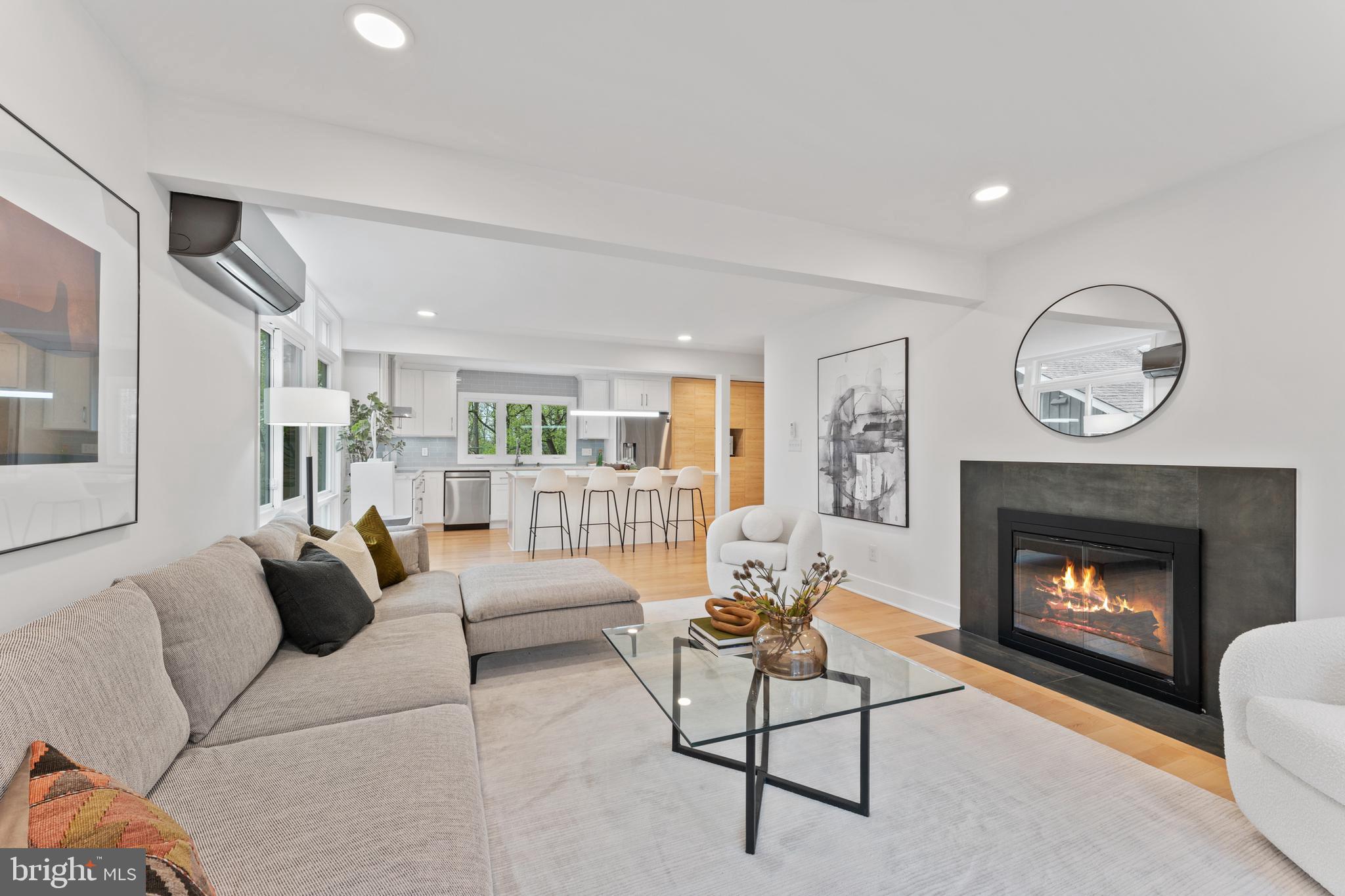 6522 Walhonding Road Bethesda, MD 20816 - Photo 5 of 76 a living room with furniture and a fireplace