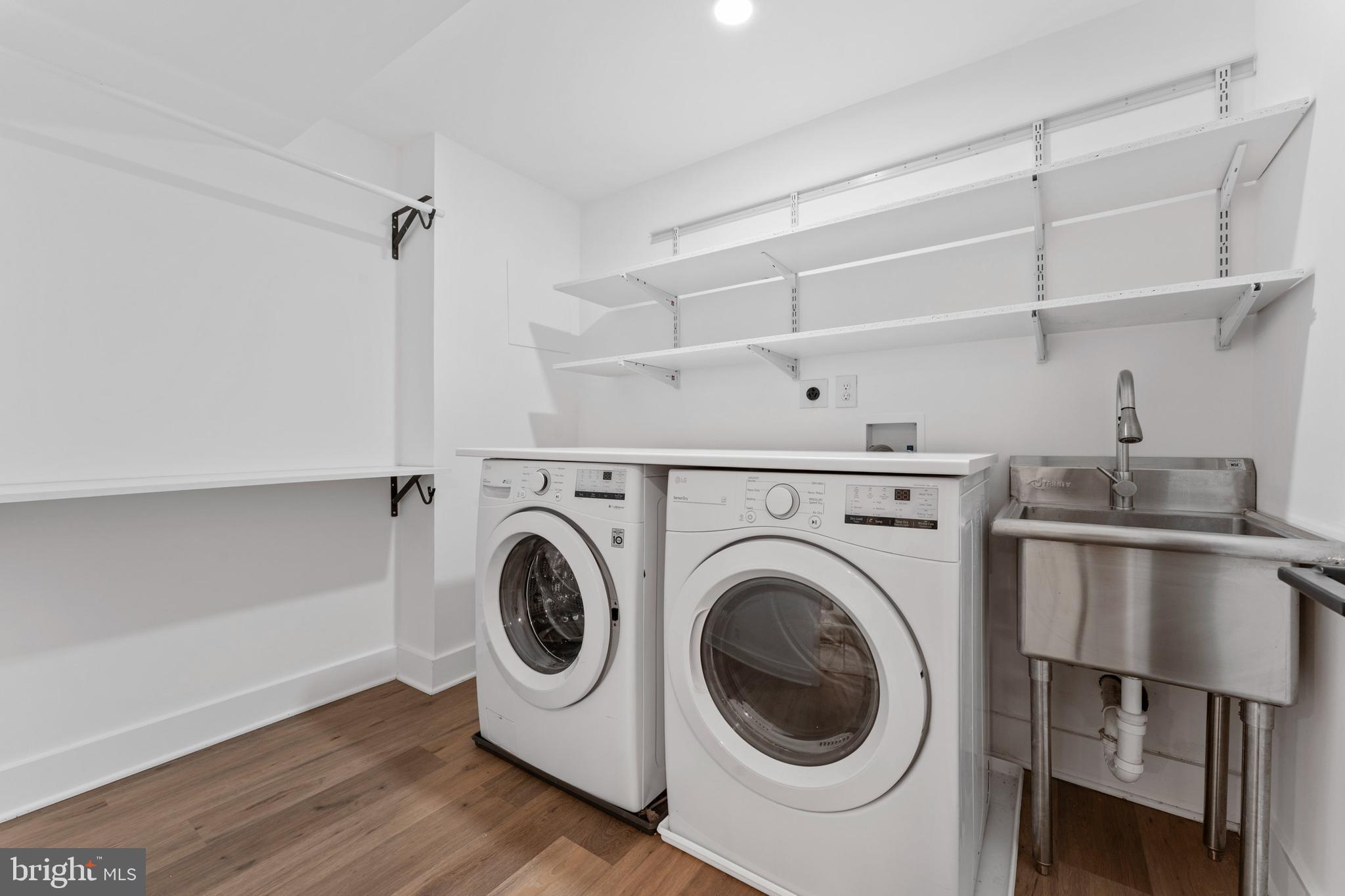 6522 Walhonding Road Bethesda, MD 20816 - Photo 58 of 76 a utility room with sink dryer and washer