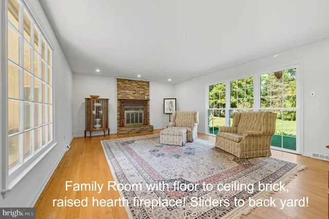 a living room with furniture and large window