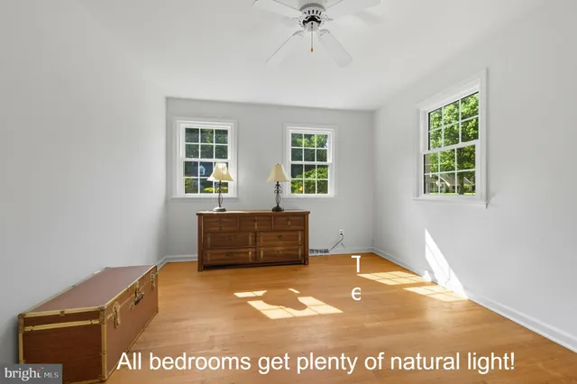 a bedroom with a bed and a book shelf