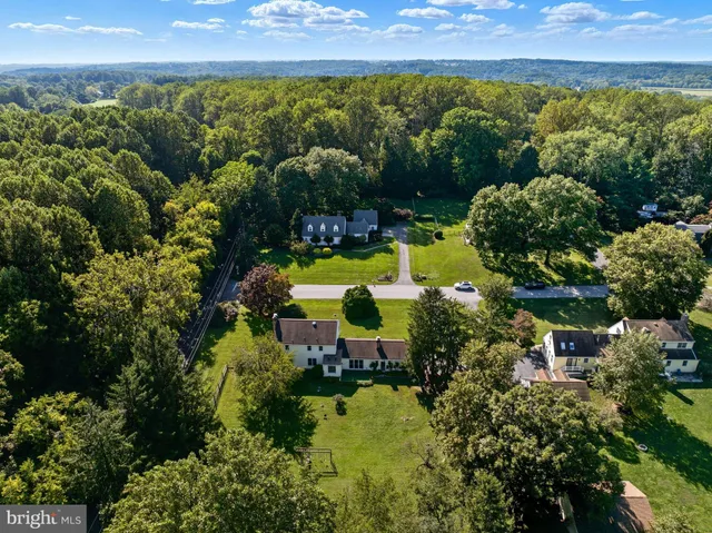 a front view of house with yard and trees