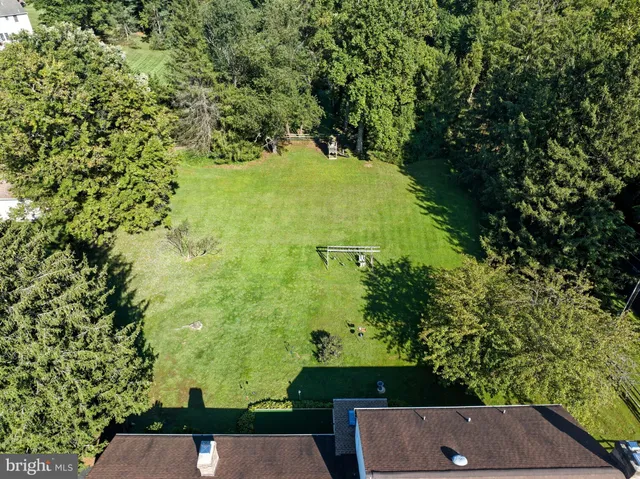 a swimming pool view with a outdoor seating