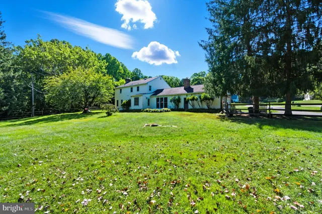an aerial view of a houses with a yard