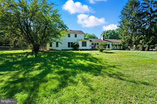 an aerial view of a houses with a yard