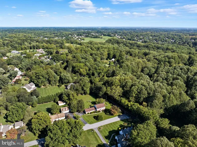 an aerial view of a house with a garden