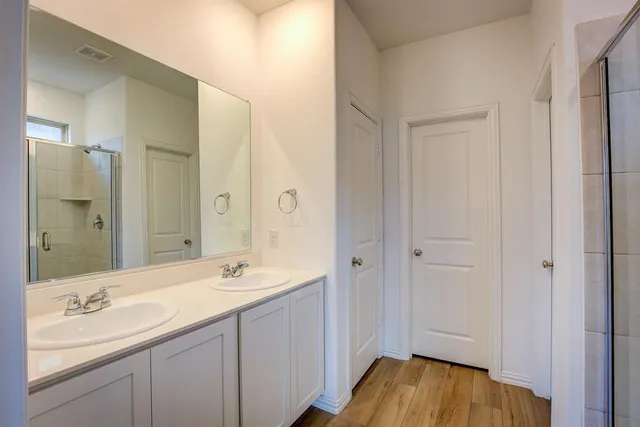 a bathroom with a sink and a mirror