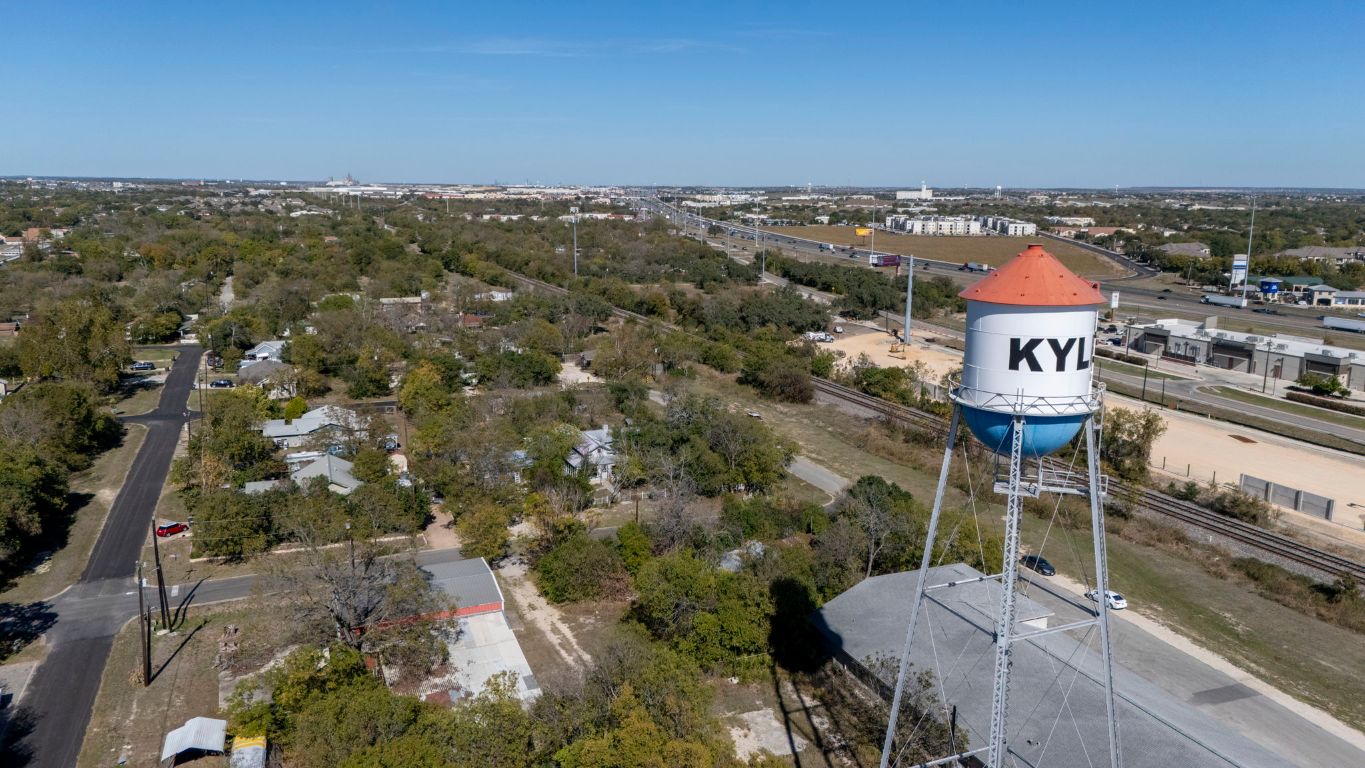 313 North Front Street Kyle, TX 78640 - Photo 16 of 28 an aerial view of a residential apartment building with a yard
