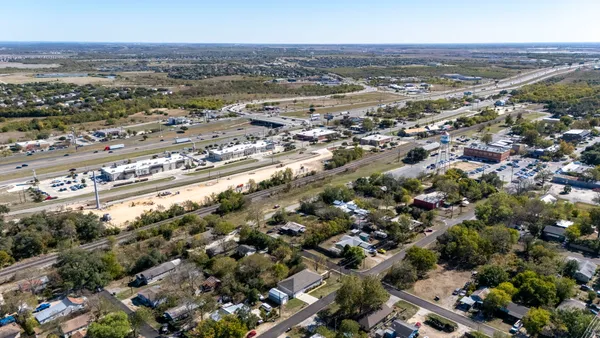 an aerial view of residential building and parking space