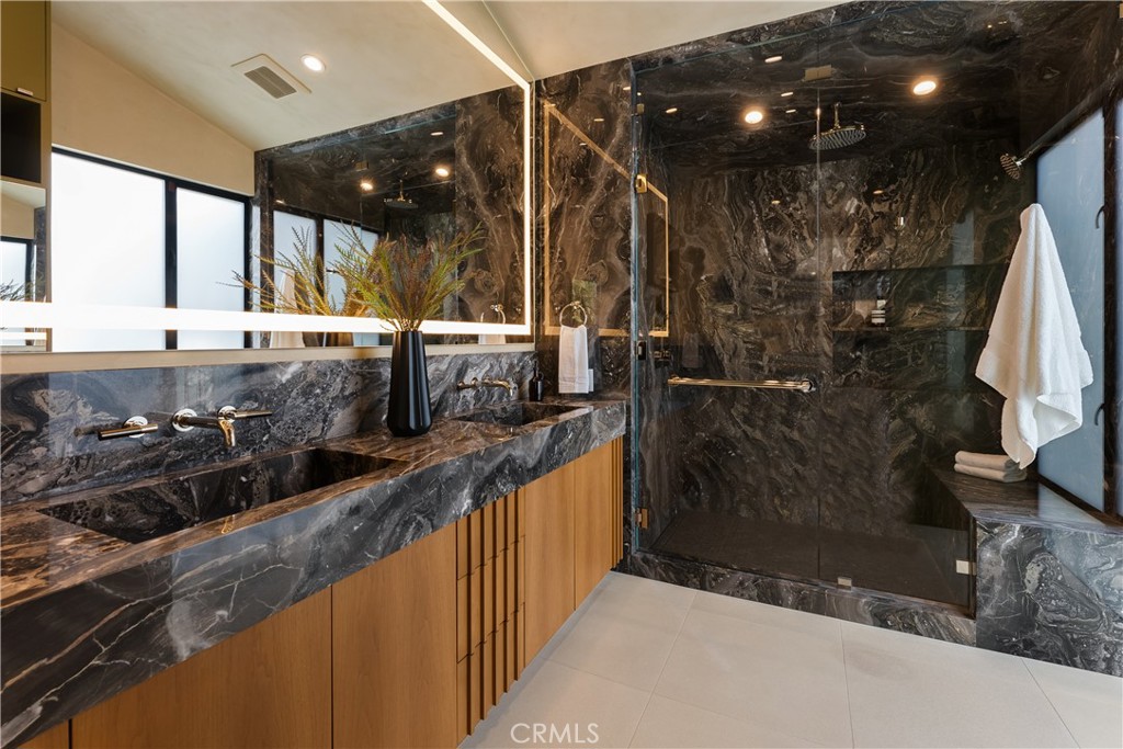 21656 Las Flores Heights Road Malibu, CA 90265 - Photo 26 of 71 primary bathroom with heated floors and custom stone work