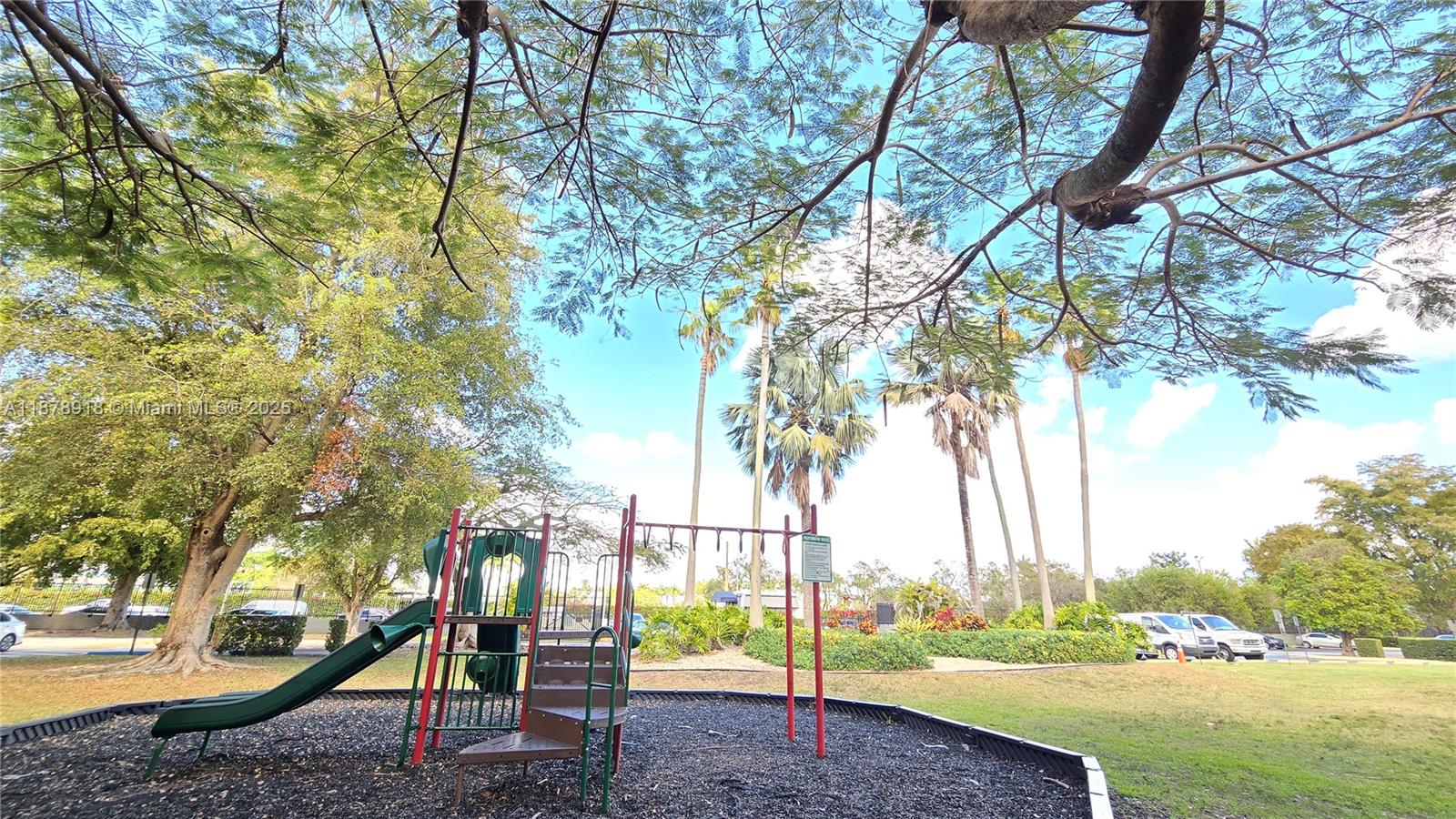 11060 Southwest 196th Street, Unit 401 Cutler Bay, FL 33157 - Photo 12 of 17 a view of a park with large trees
