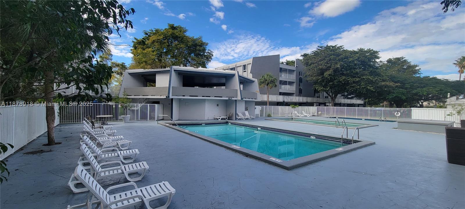 11060 Southwest 196th Street, Unit 401 Cutler Bay, FL 33157 - Photo 17 of 17 a view of a chairs and table in the back yard of the house