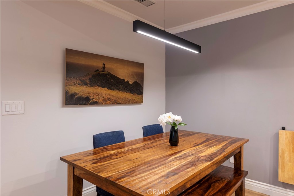 20702 El Toro Road, Unit 178 Lake Forest, CA 92630 - Photo 6 of 30 a dining room with a table and chairs