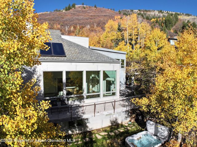 a view of a room with wooden floor and white walls