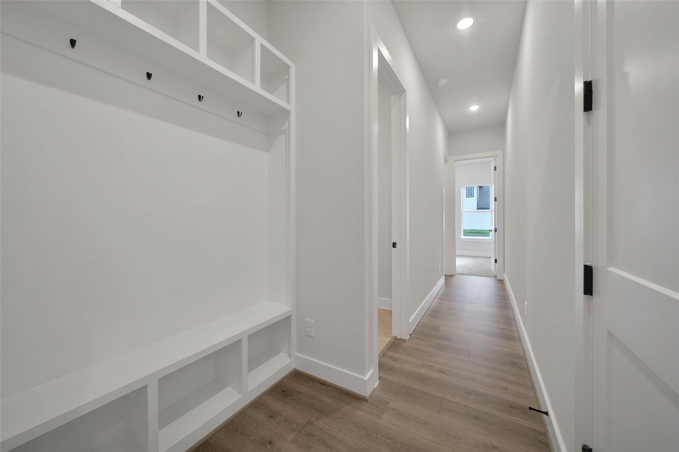 4610 Magnolia Bend Drive Rosharon, TX 77583 - Photo 37 of 48 a view of a hallway with wooden floor