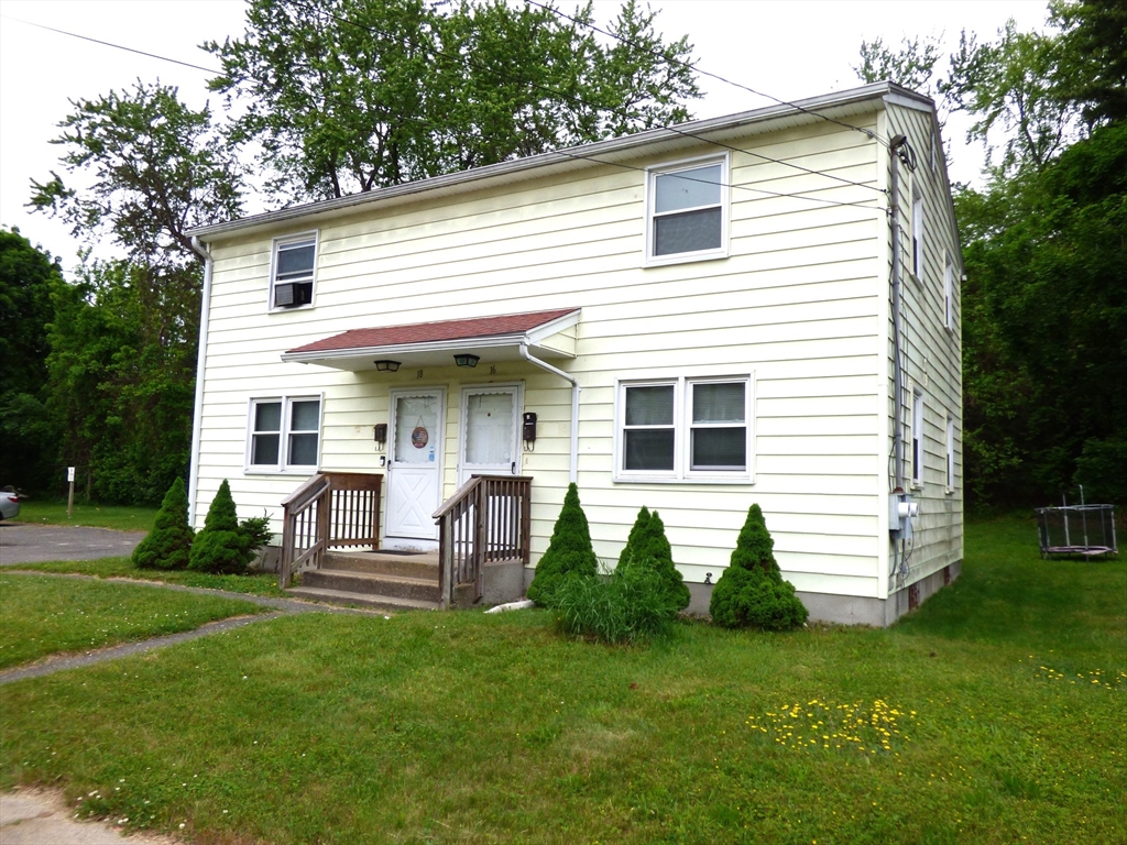 16-18 Daniel Street Springfield, MA 01151 - Photo 1 of 14 a view of a house with a backyard