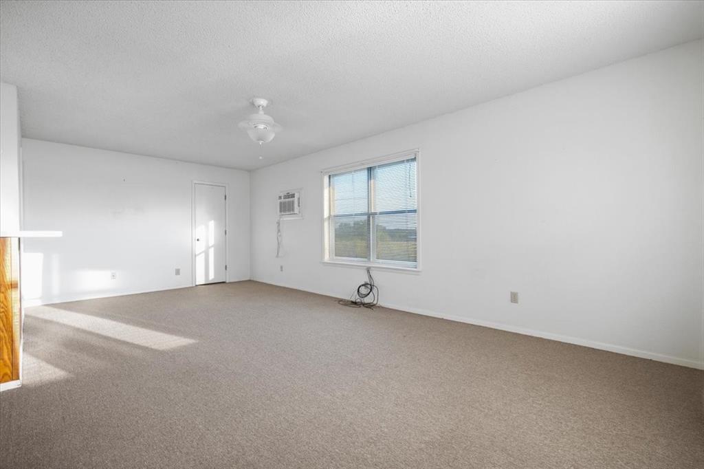 105 Riverside Drive Mineral Wells, TX 76067 - Photo 3 of 40 Property entrance with roof with shingles and brick siding