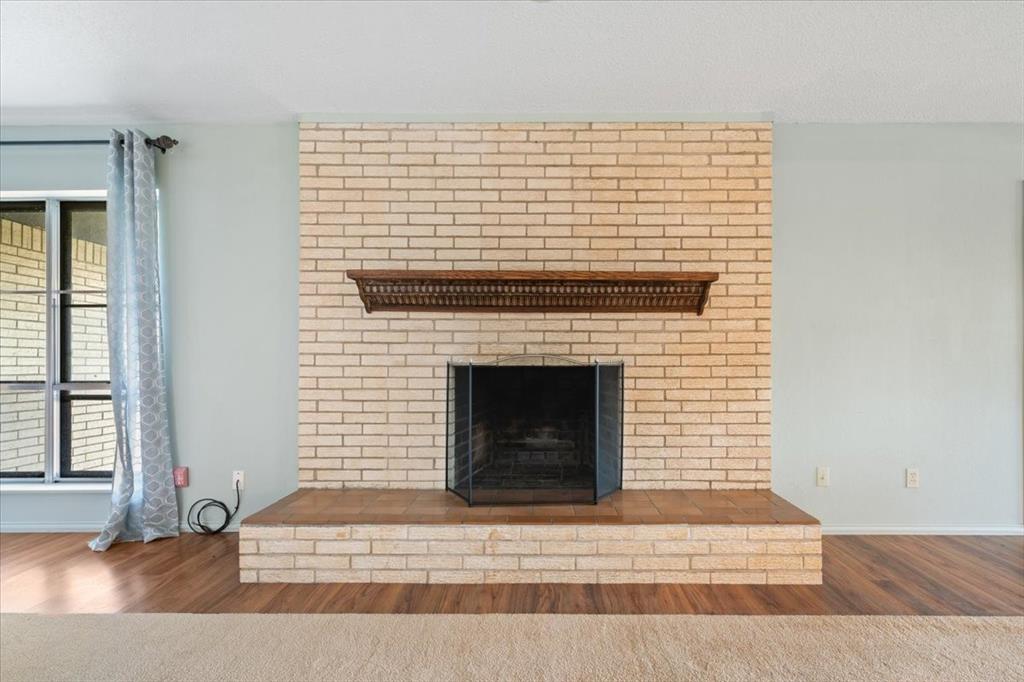 105 Riverside Drive Mineral Wells, TX 76067 - Photo 10 of 40 Kitchen with glass insert cabinets, decorative light fixtures, decorative backsplash, and dark stone counters