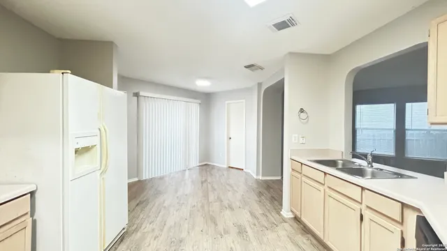 a bathroom with a sink a mirror and a shower