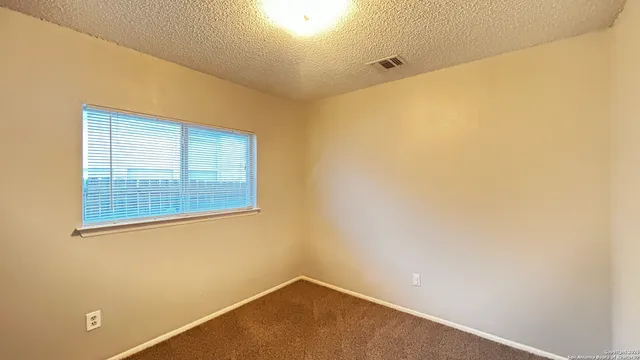 a view of a small space with a window