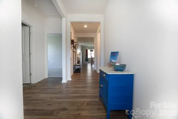 a kitchen with stainless steel appliances granite countertop a stove refrigerator and a sink