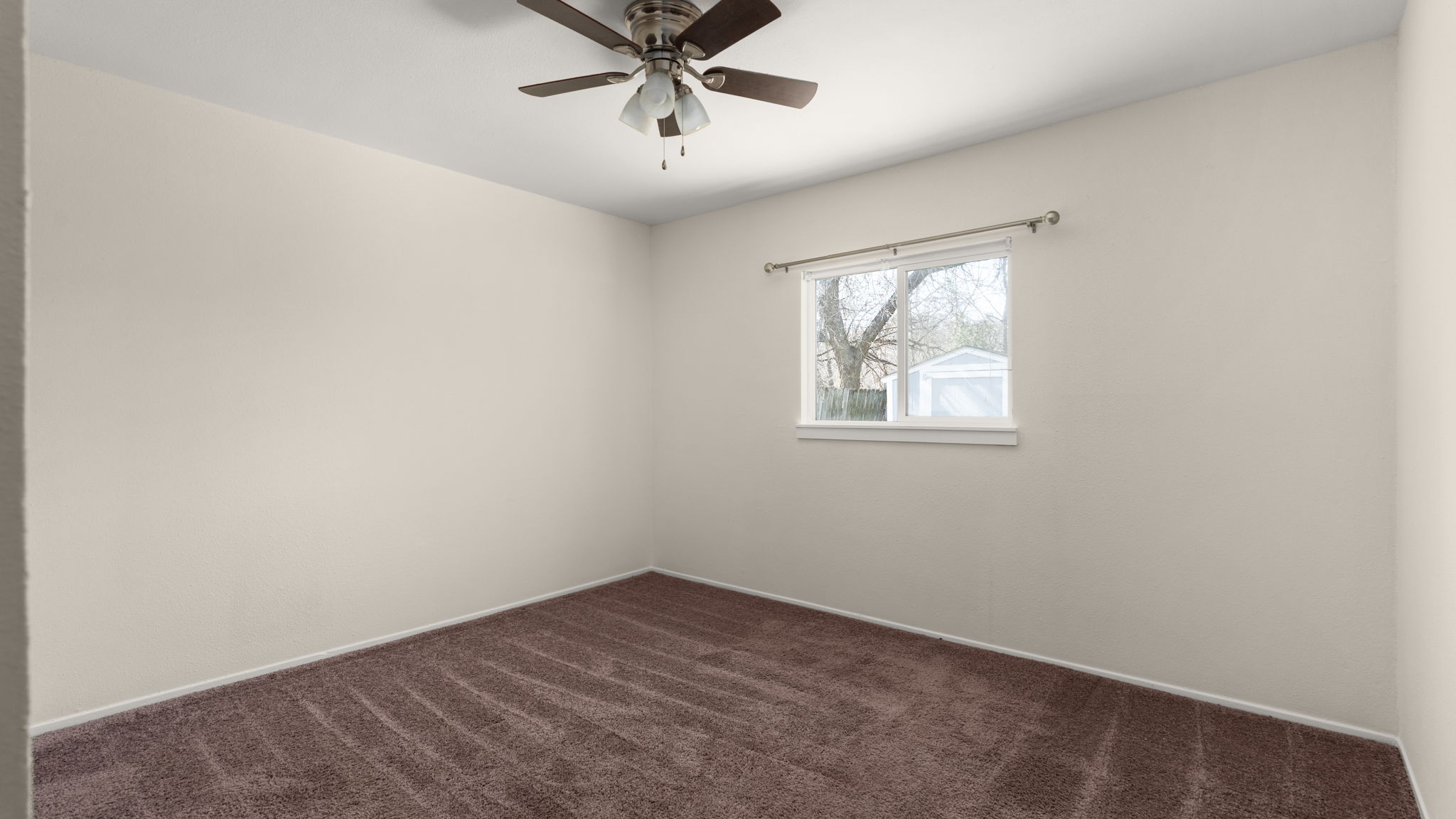 1618 Chippeway Lane Austin, TX 78745 - Photo 18 of 39 Bedroom one with ceiling fan and fresh paint.