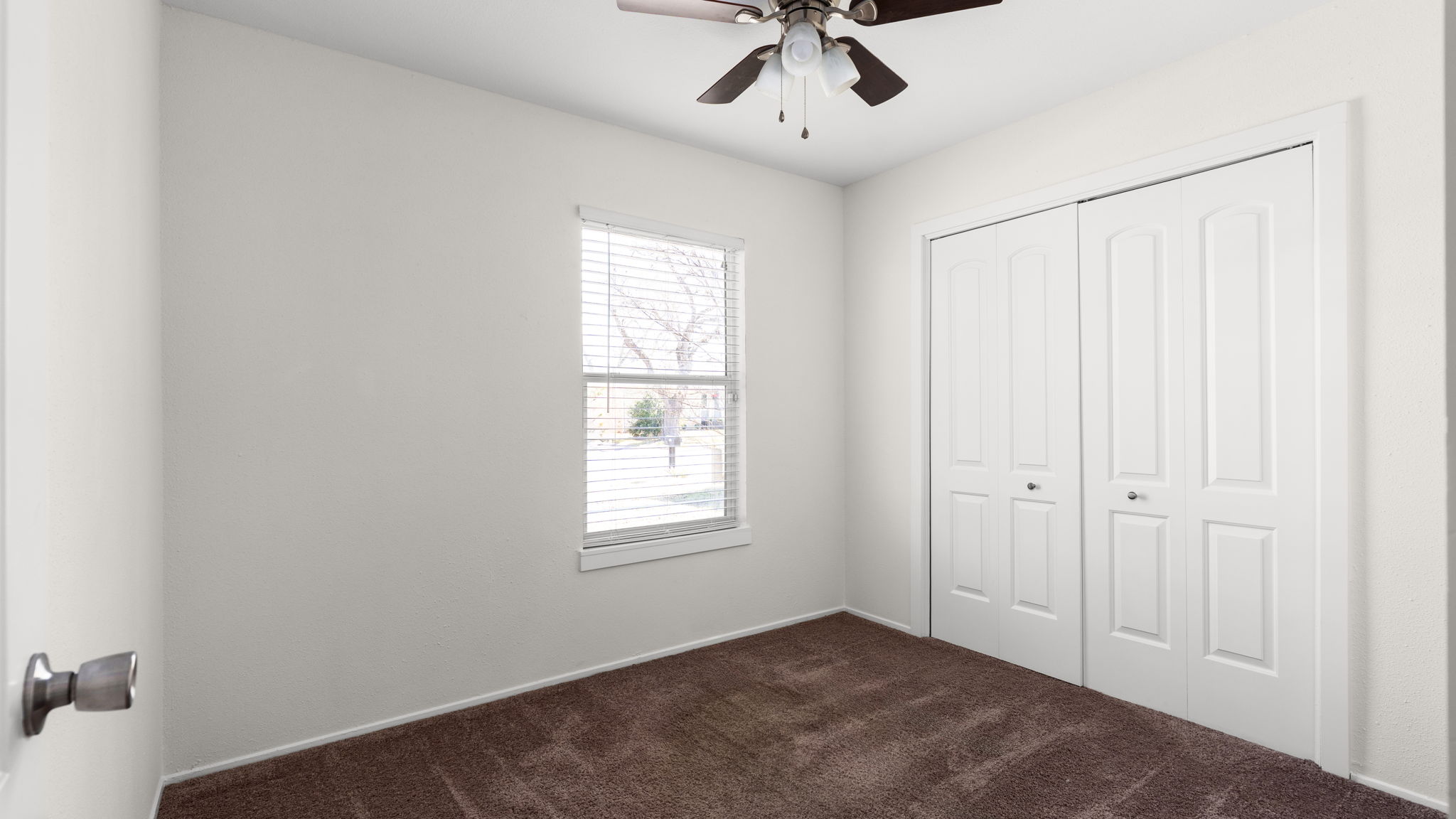 1618 Chippeway Lane Austin, TX 78745 - Photo 21 of 39 Bedroom two with ceiling fan and fresh pain.