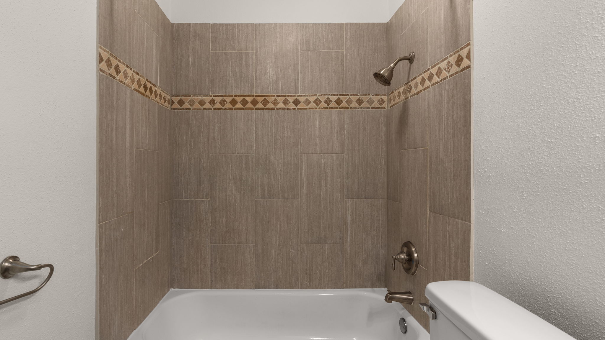 1618 Chippeway Lane Austin, TX 78745 - Photo 23 of 39 Full bath with a textured wall and shower / tub combination