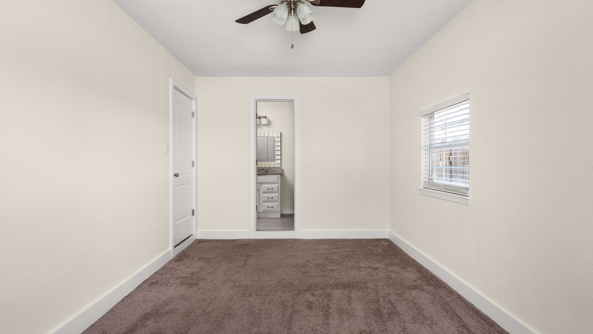 1618 Chippeway Lane Austin, TX 78745 - Photo 27 of 39 Largest bedroom with full bathroom.
(garage space converted to bedroom ). Primary bedroom