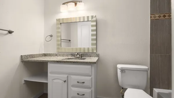 a bathroom with a shower and a toilet