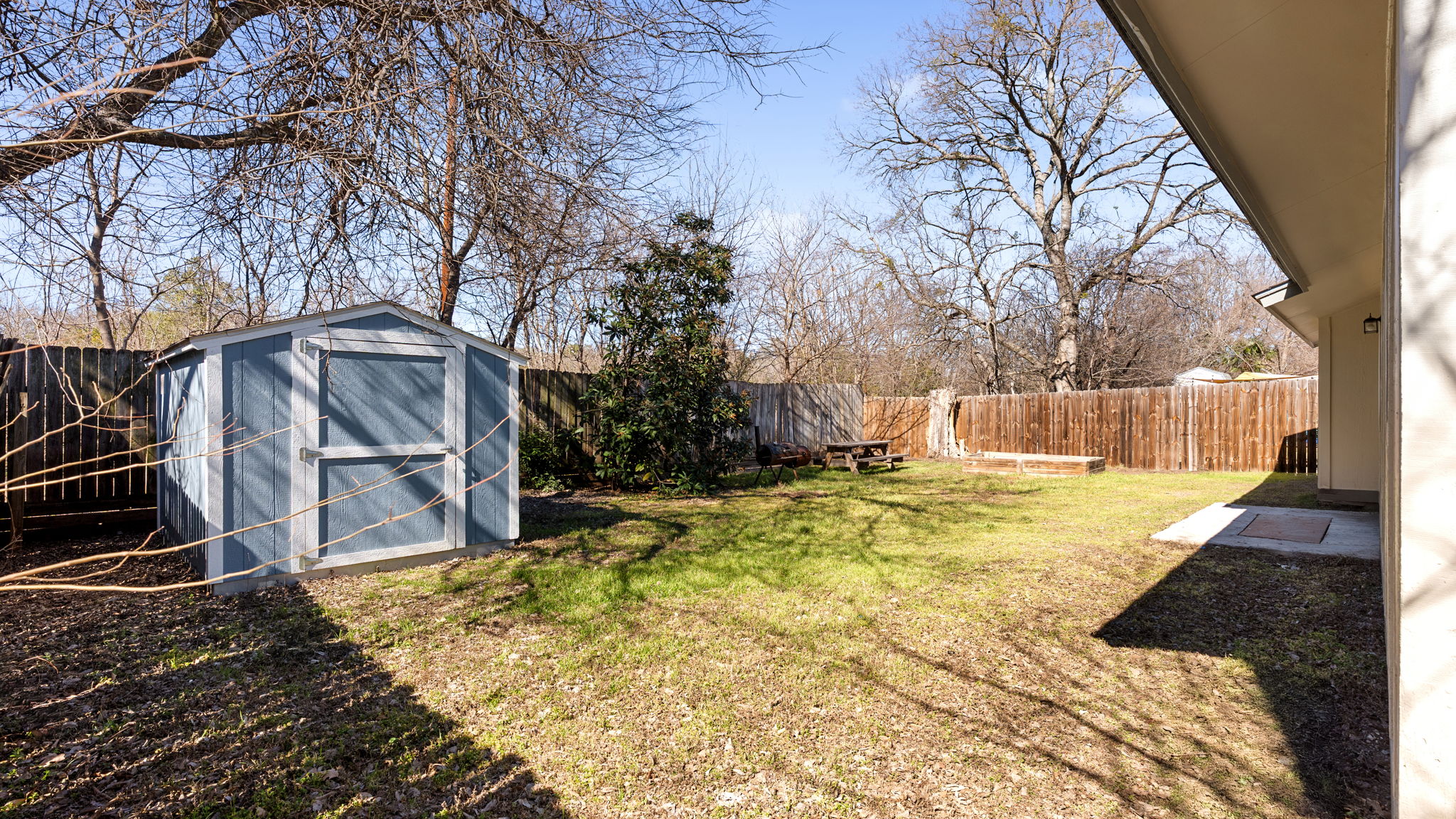 1618 Chippeway Lane Austin, TX 78745 - Photo 32 of 39 Fenced backyard featuring a storage unit