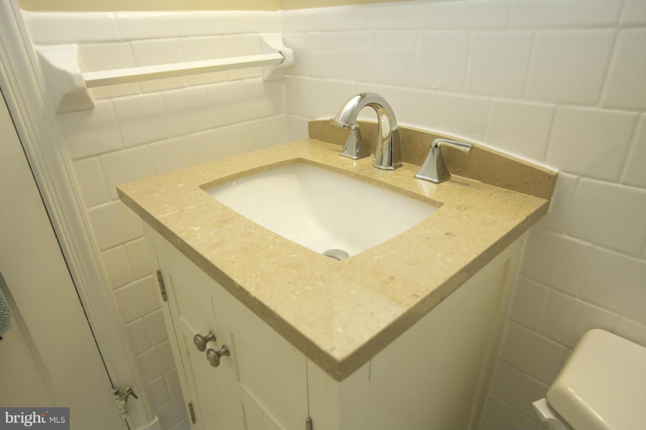 6503 Old Orchard Road Baltimore, MD 21239 - Photo 16 of 26 Close-up of Vanity upgrade/stone counter