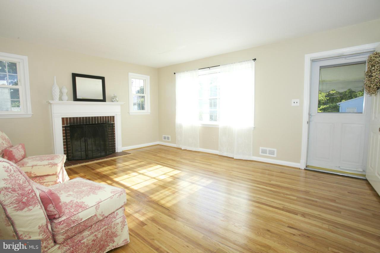6503 Old Orchard Road Baltimore, MD 21239 - Photo 5 of 26 Replacement corner wdws flank fireplace